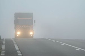 Truck appearing through fog 