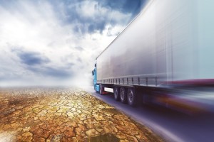 Speeding Transportation Truck driving on the road through the desert